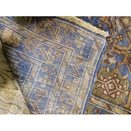 310 - Afghan woollen rectangular rug with geometric design on blue/green ground approx. 288 x 188cm