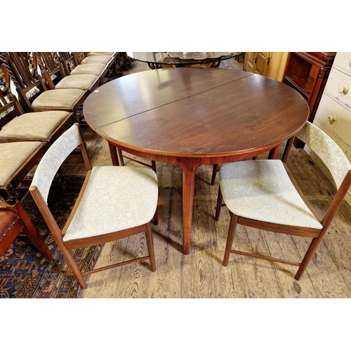 361 - Vintage teak dining suite comprising extending table and four upholstered chairs