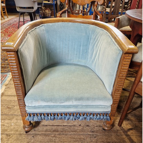 362 - Early oak framed upholstered tub chair on castors