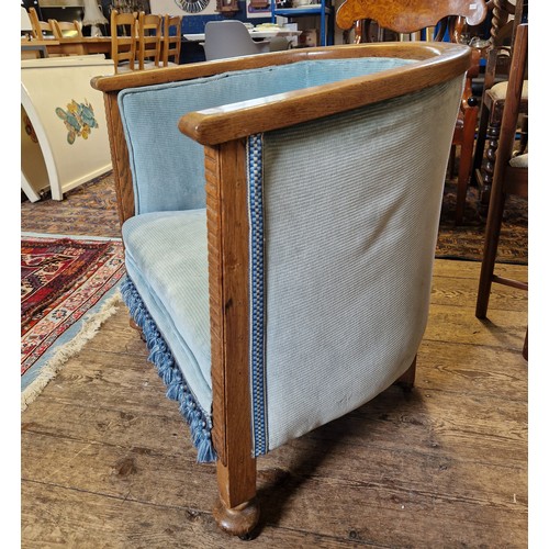 362 - Early oak framed upholstered tub chair on castors