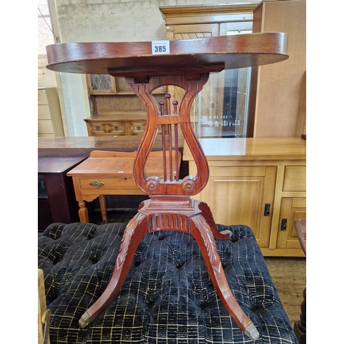 385 - Reproduction mahogany oval occasional table with gallery on lire form support