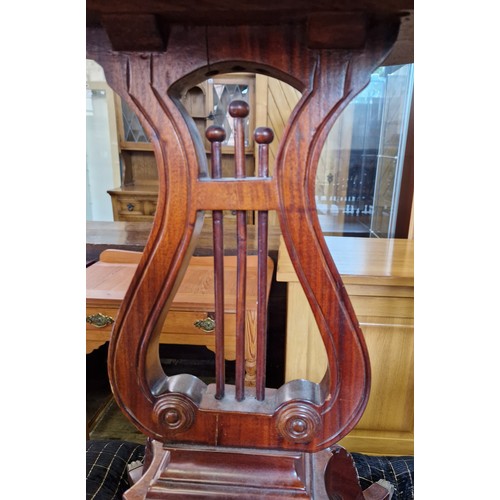 385 - Reproduction mahogany oval occasional table with gallery on lire form support