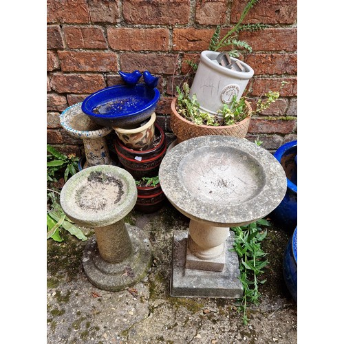 441 - Two simulated stone bird baths and quantity of terracotta platers