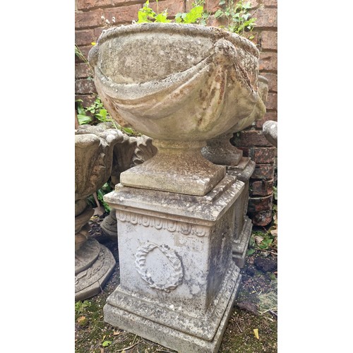 448 - Pair simulated stone pedestal urns on plinths with swag detail