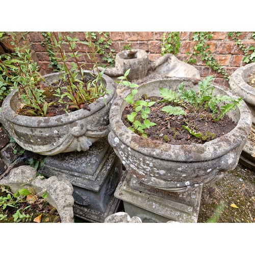 448 - Pair simulated stone pedestal urns on plinths with swag detail