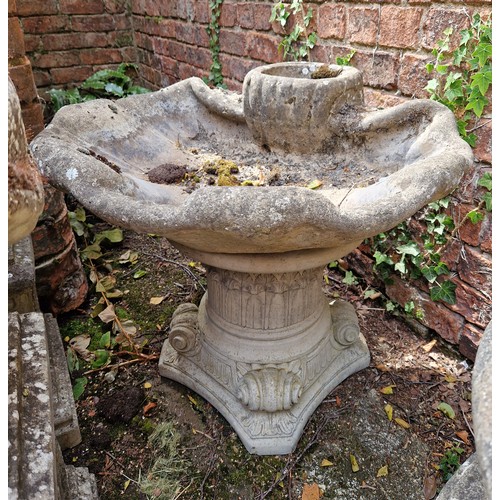 449 - Large simulated stone shell form bird bath on plinth