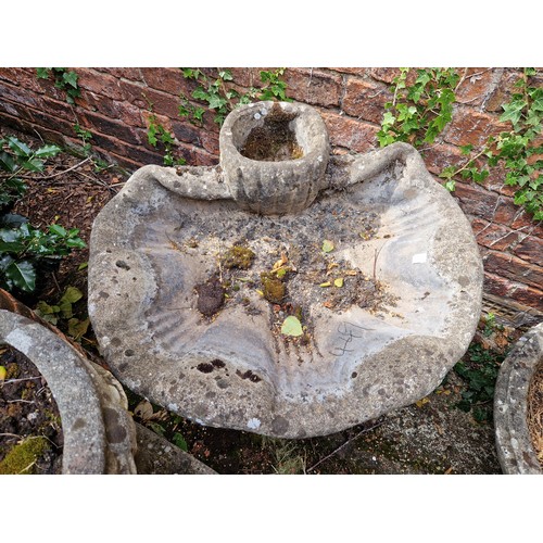 449 - Large simulated stone shell form bird bath on plinth