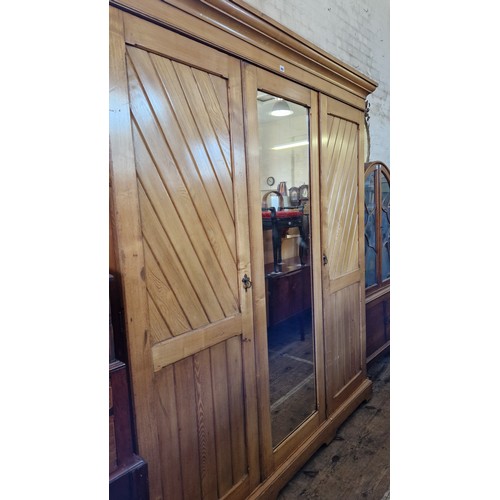 404 - Edwardian birch wardrobe/linen press with central mirrored panel, fitted interior of slides and draw... 