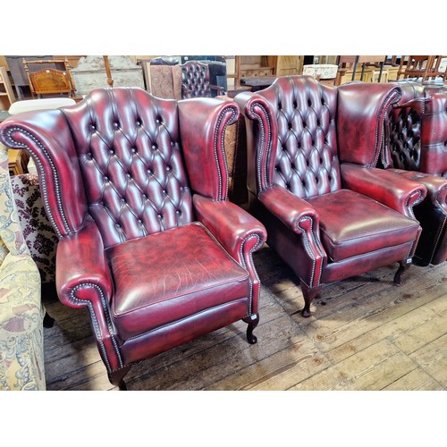 329 - Pair of modern maroon leather buttoned back upholstered wing armchairs on cabriole legs and a matchi... 