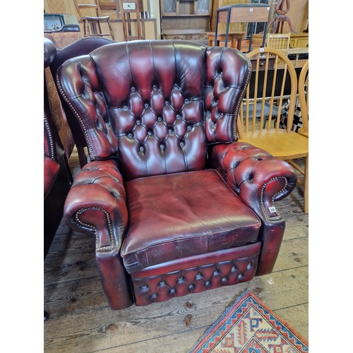 330 - Modern maroon leather buttoned back reclining arm chair