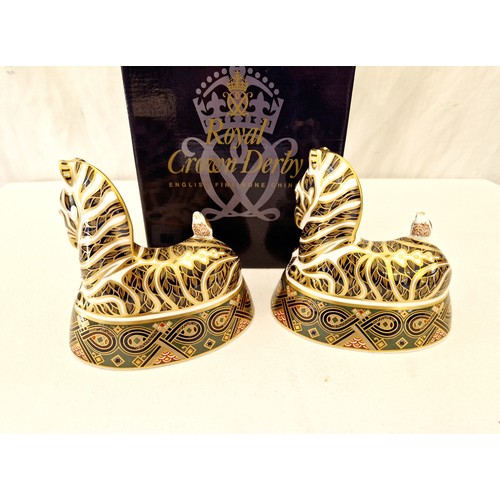 58 - Royal Crown Derby, pair of Zebra paperweights both silver stoppers, one boxed