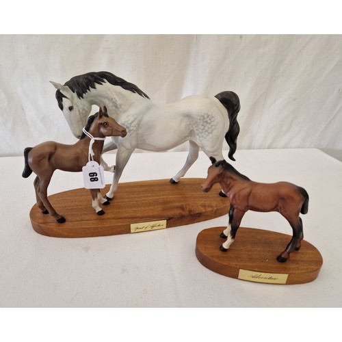 68 - Two Beswick bisque plinth mounted horse figurines; Spirit of Affection and Adventure