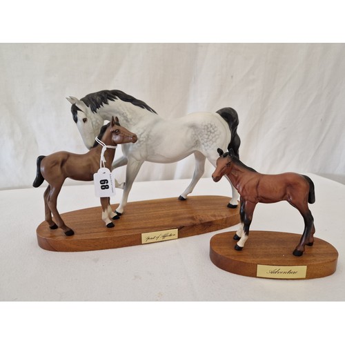 68 - Two Beswick bisque plinth mounted horse figurines; Spirit of Affection and Adventure