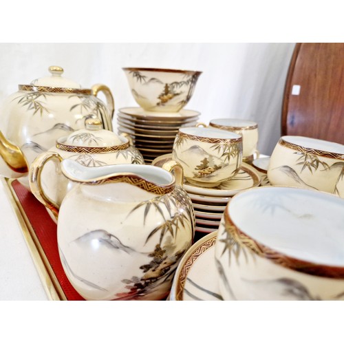 95 - Quantity of oriental gilt and cream decorative teaware