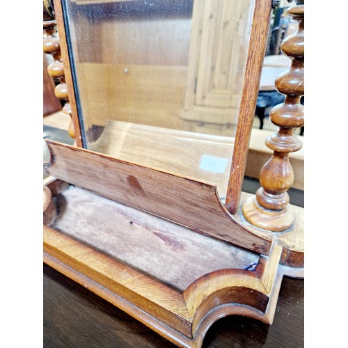 259 - Rectangular swing toilet mirror on mahogany base with bobbin turned supports