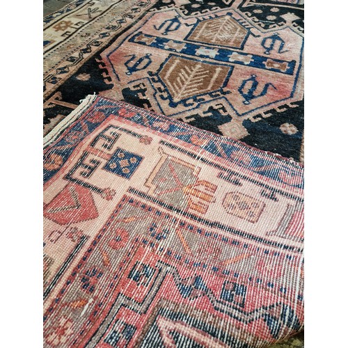 272 - Multi coloured geometric pattern woollen rug approx. 245cm x 130cm