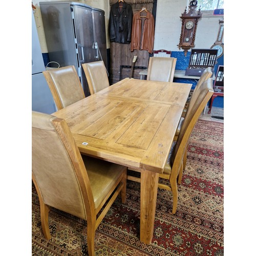 281 - Modern light oak dining suite comprising rectangular plank grove top table and 6 chairs with leather... 