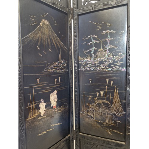 283 - Ebonised oriental four-panel screen with mother of pearl inlay pictorial panels