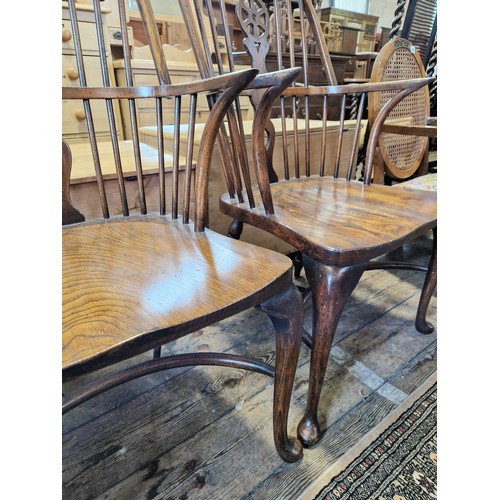 290 - Pair of yew and elm Windsor wheel back chairs with cabriole front legs and crinoline stretchers