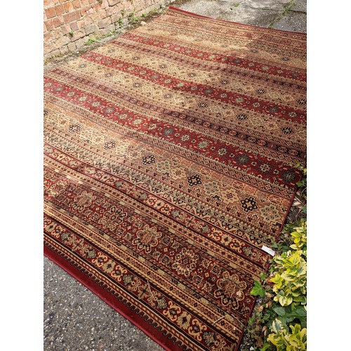 276 - Modern Kendra Egyptian polypropylene red and brown banded rug approx. 340cm x 240cm