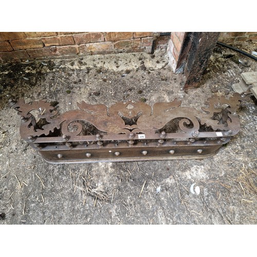 379 - Late Victorian fender with pierced metal decoration depicting unicorns on baluster supports approx. ... 