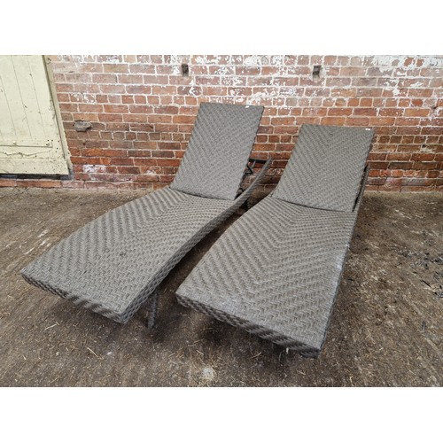 405 - A pair of faux raffia garden loungers