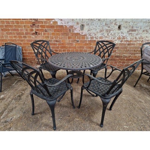 407 - Metal circular garden table and 4 chairs