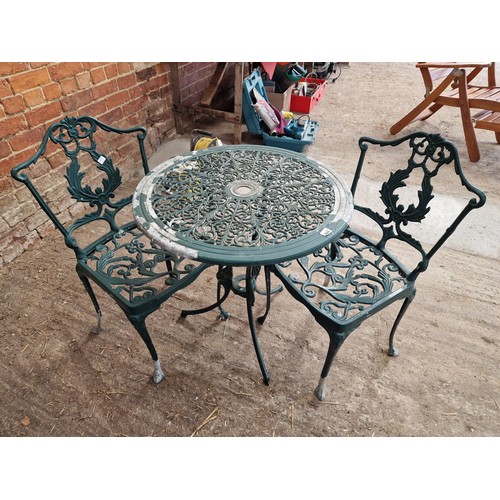 488 - Modern pierced metal circular garden table and two chairs