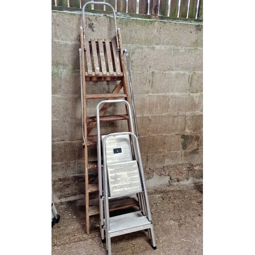 546 - Two pairs of aluminium step ladders and a wooden set