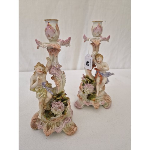 46 - Pair of mid-19th century German organic form putti candlesticks