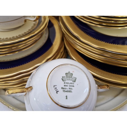 54 - Qty of Aynsley blue and gilt dinnerware