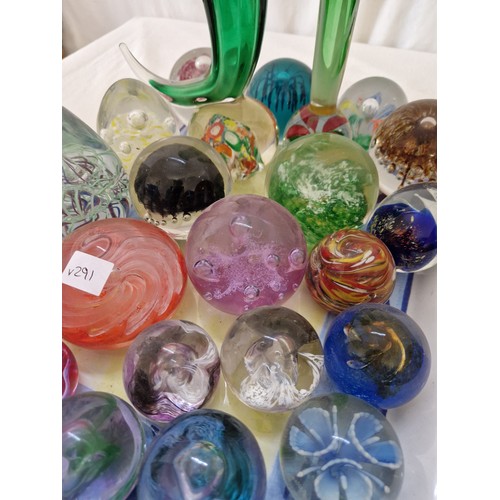 77 - Collection of various coloured glass paperweights