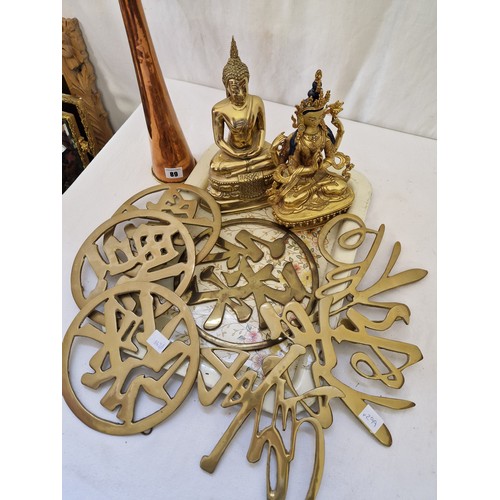 89 - Brass Hindu figures, character trivets and coaching horn