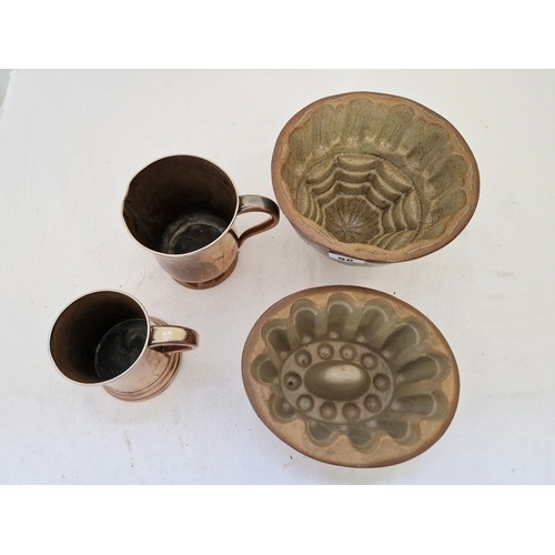 98 - Two vintage stoneware jelly moulds and two Sheffield copper tankards