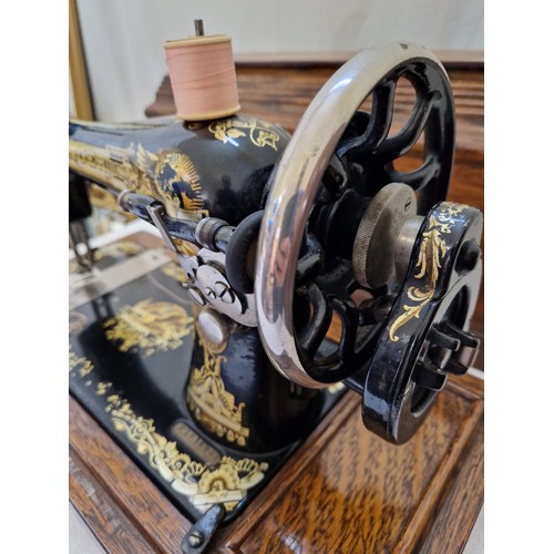 155 - Oak cased vintage Singer sewing machine