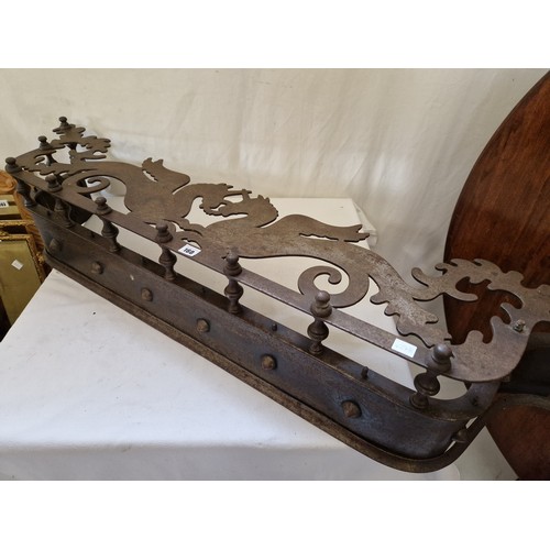 160 - Edwardian steel fender with pierced mythical beast plate