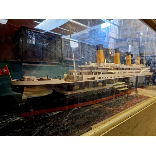 171 - Model of RMS Titanic in cabinet with illumination; wooden home built, case 6' (w) x 37.5