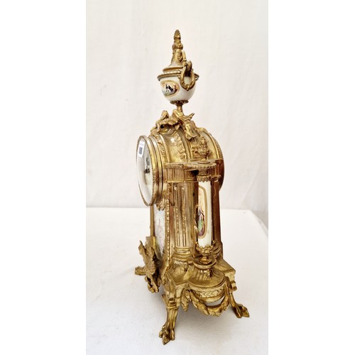 180 - Gilt brass German empire clock with pictorial ceramic panels and pillars