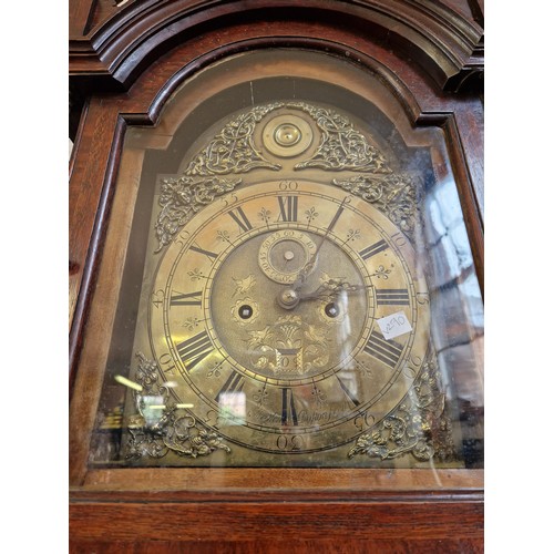 183 - Oak long case clock with domed and pierced hood enclosing an eight-day movement and brass dial by Jo... 