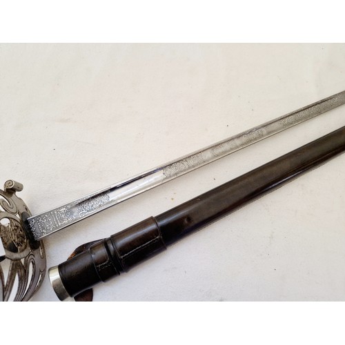 201 - A British cavalry sword with pierced guard, wire bound fish skin grip in a leather-bound scabbard by... 