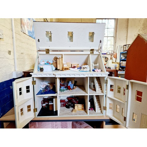 268 - Modern plastic bay fronted dolls house and contents