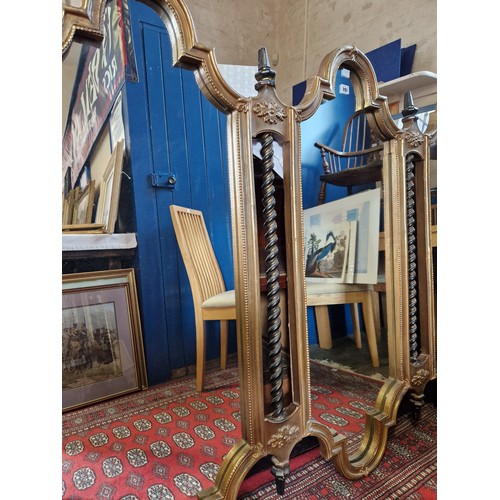 297 - Reproduction gilt and ebony ornate three panel wall mirror approx. 160cm (w) x 122cm (h)