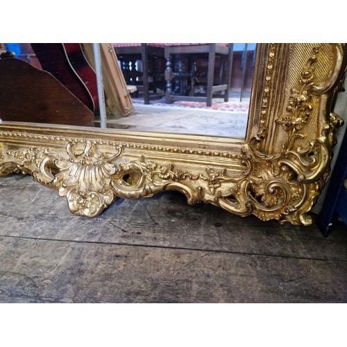 312 - Large modern rectangular wall mirror with ornate gilt effect shell and scroll surround approx. 126cm... 