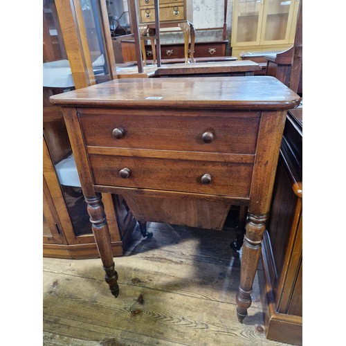 349 - Victorian mahogany workbox with dummy drawer front and side door on turned legs to castors