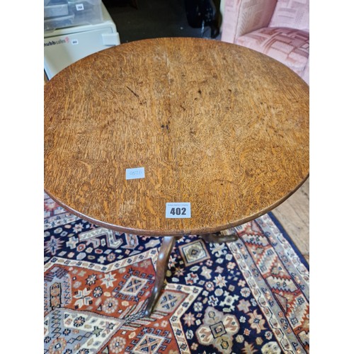 402 - Victorian oak tilt-top circular occasional table