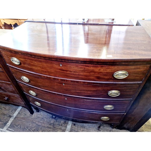 420 - 19th century bow fronted mahogany chest of four graduating drawers with oval brass handles on turned... 