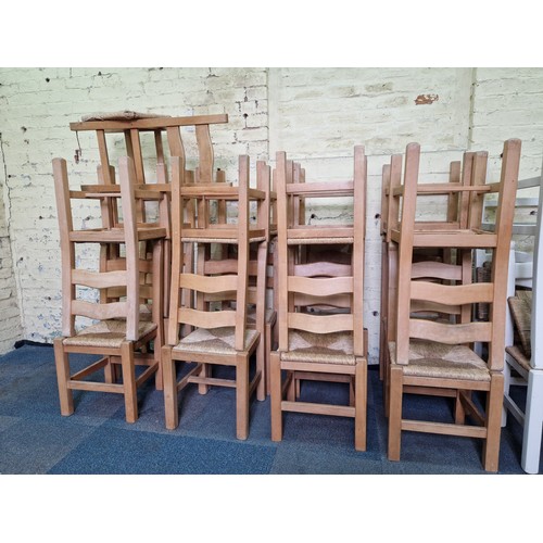 449 - A set of 17 modern solid beech ladder-back dining chairs with rush seats