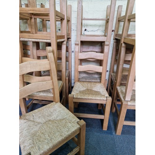 449 - A set of 17 modern solid beech ladder-back dining chairs with rush seats