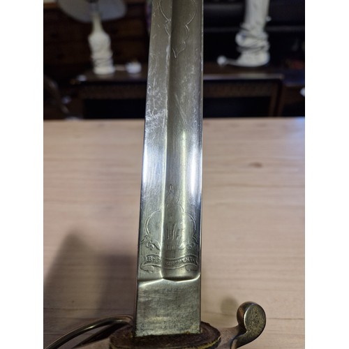 203 - A Victorian British officer's sword with swept guard, wire bound fish skin grip, VR cypher to the bl... 