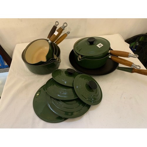 127 - Qty of green Le Creuset saucepans and including 4 graduated saucepans with lids
